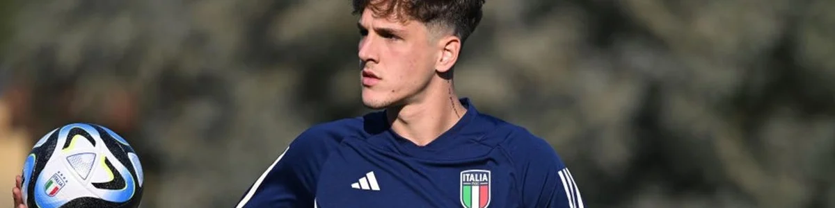 Nicolò zaniolo, italian football player, with a football in his hand