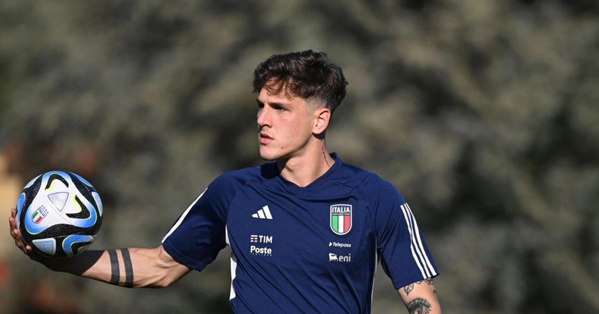 Nicolò zaniolo, italian football player, with a football in his hand