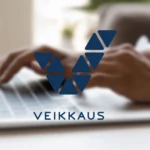 Veikkaus logo on a blurred background showing a person typing on a laptop keyboard