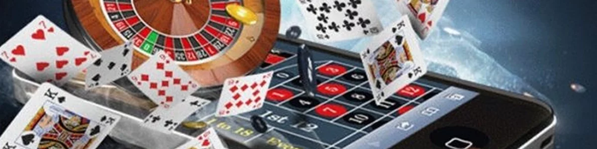 Phone showing a casino game with roulette, cards, dice and chips around it.