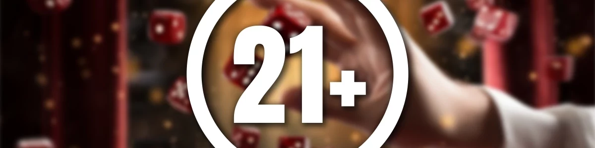 21+ in white with a circle around it on a blurred background with a hand throwing casino dice