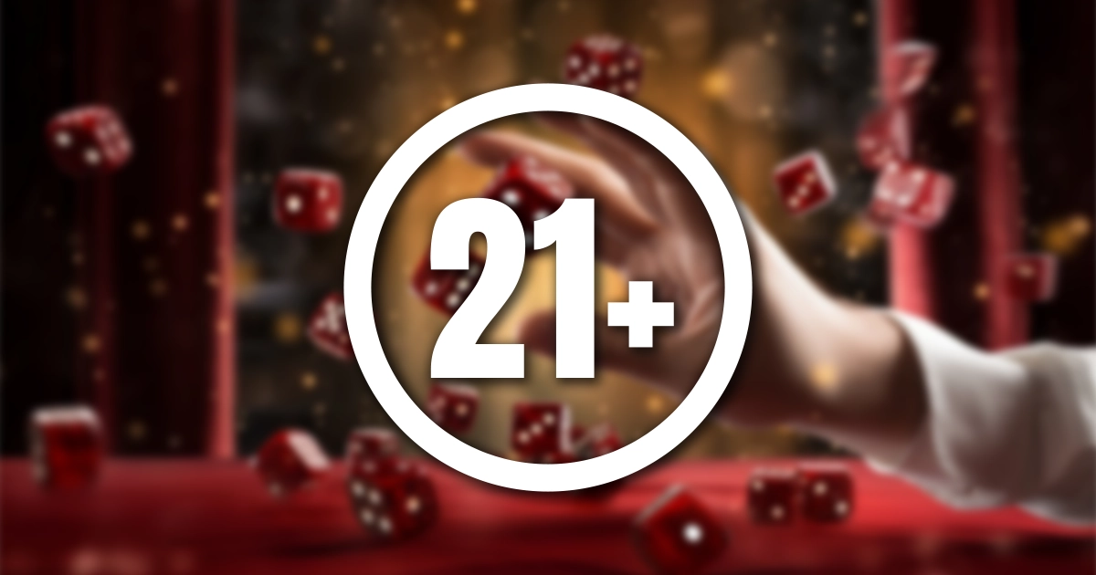 21+ in het wit met een cirkel eromheen op een onscherpe achtergrond met een hand die casinodobbelstenen gooit