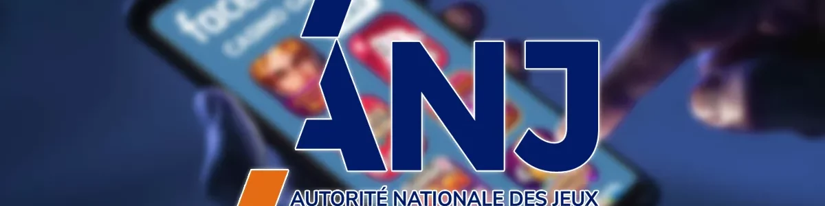 The anj logo on a background showing a phone accessing casino games on facebook.